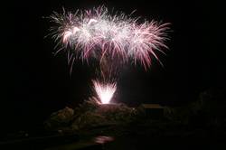 Polperro fireworks over Peak rock and the harbour