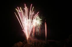 Polperro fireworks over Peak rock and the harbour