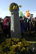 Daffodils are laid at the cross